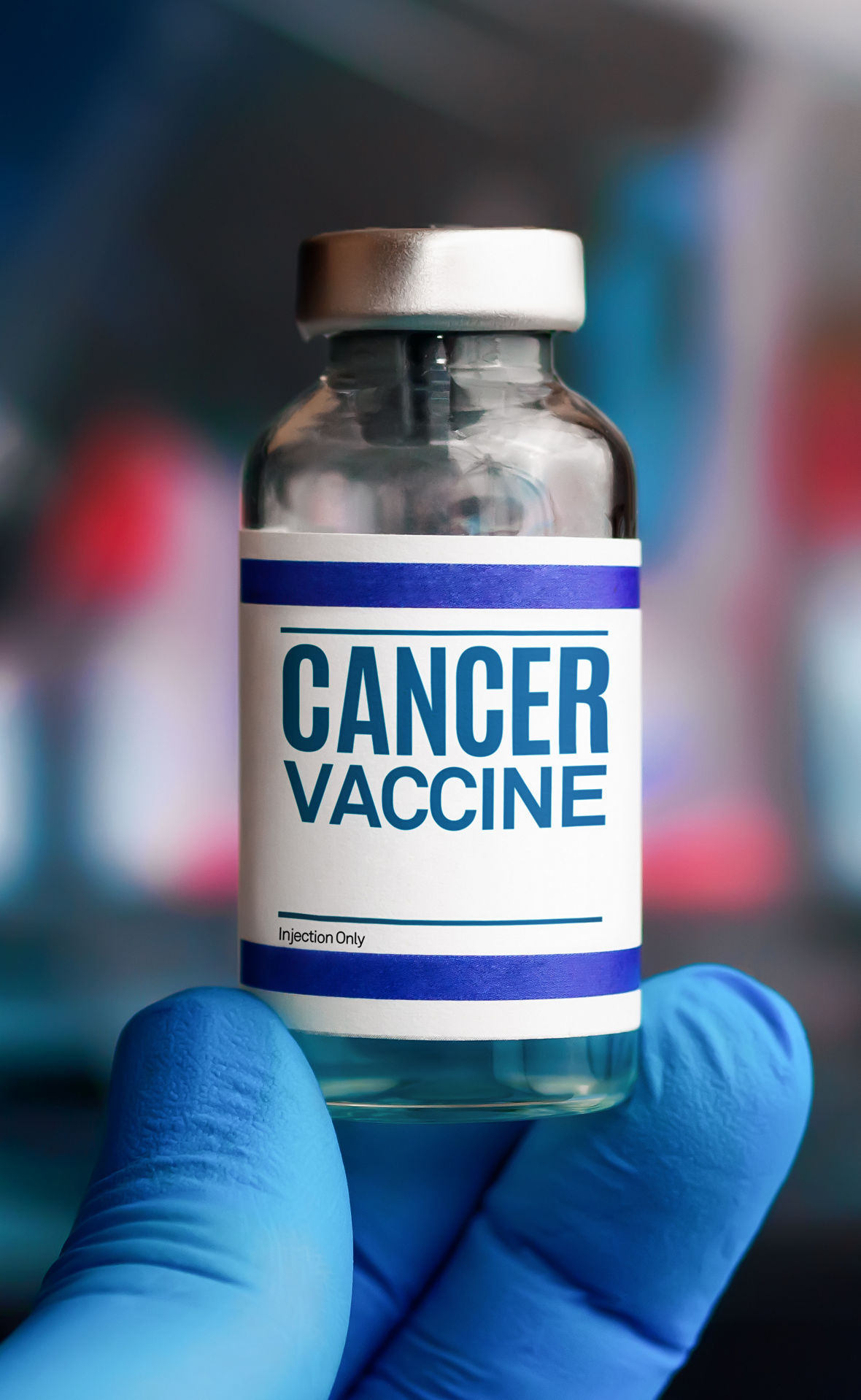 A gloved hand holds up an ampoule labeled “cancer vaccine”
