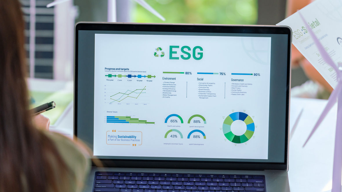 close up laptop show esg data chart at green office 