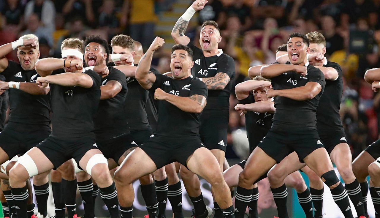 The New Zealand national rugby team performing their traditional haka.