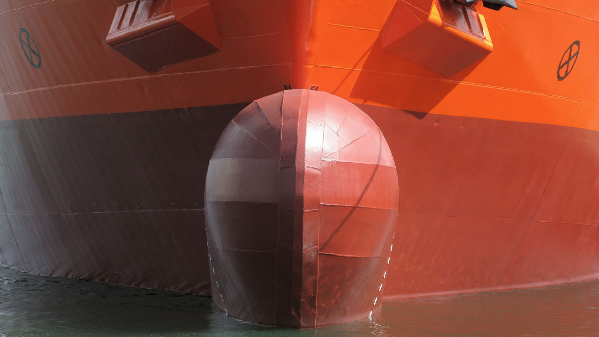 The lower part of the bow of a container ship.