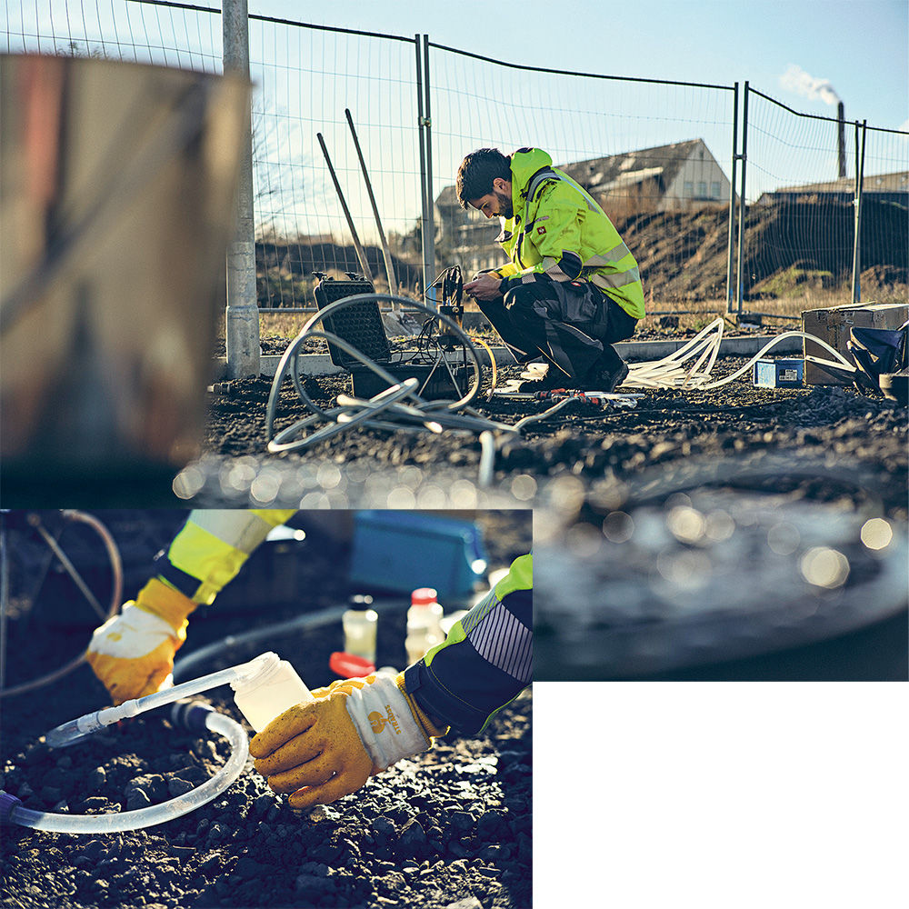 A staff member crouches down to take a water sample from the ground.