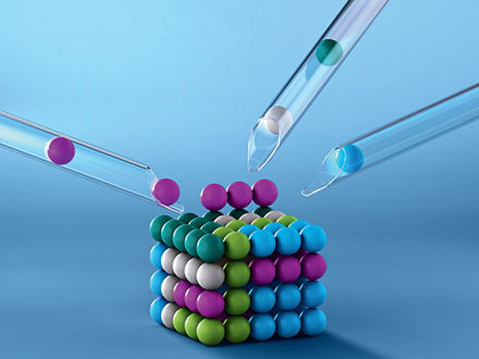 A cube made of colorful balls. Additional balls are added from three glass tubes."