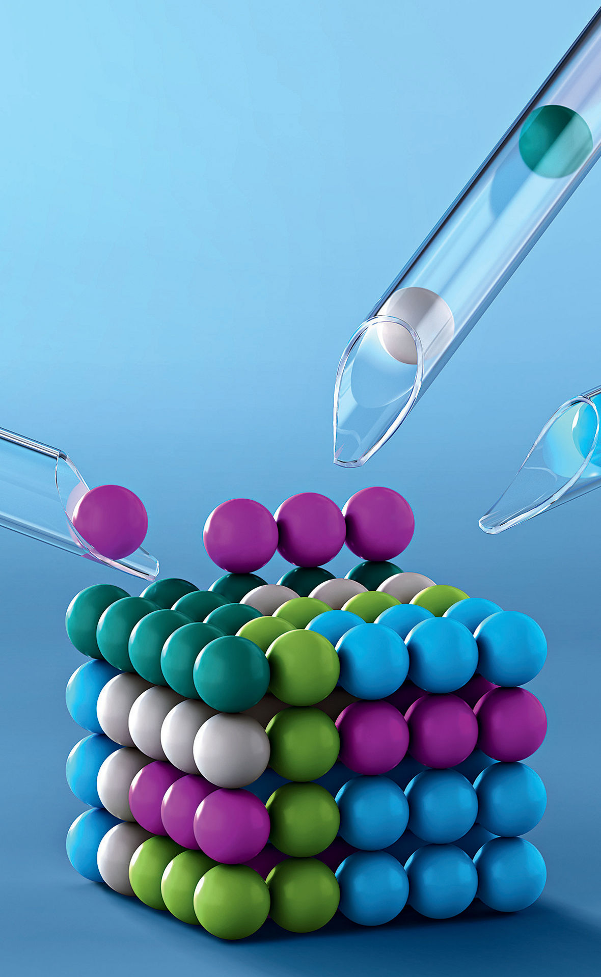 Ein Würfel aus bunten Kugeln. Aus drei Glasröhrchen werden weitere Kugeln hinzugefügt.