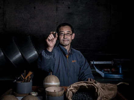 Hideki Kubota between his material pots.