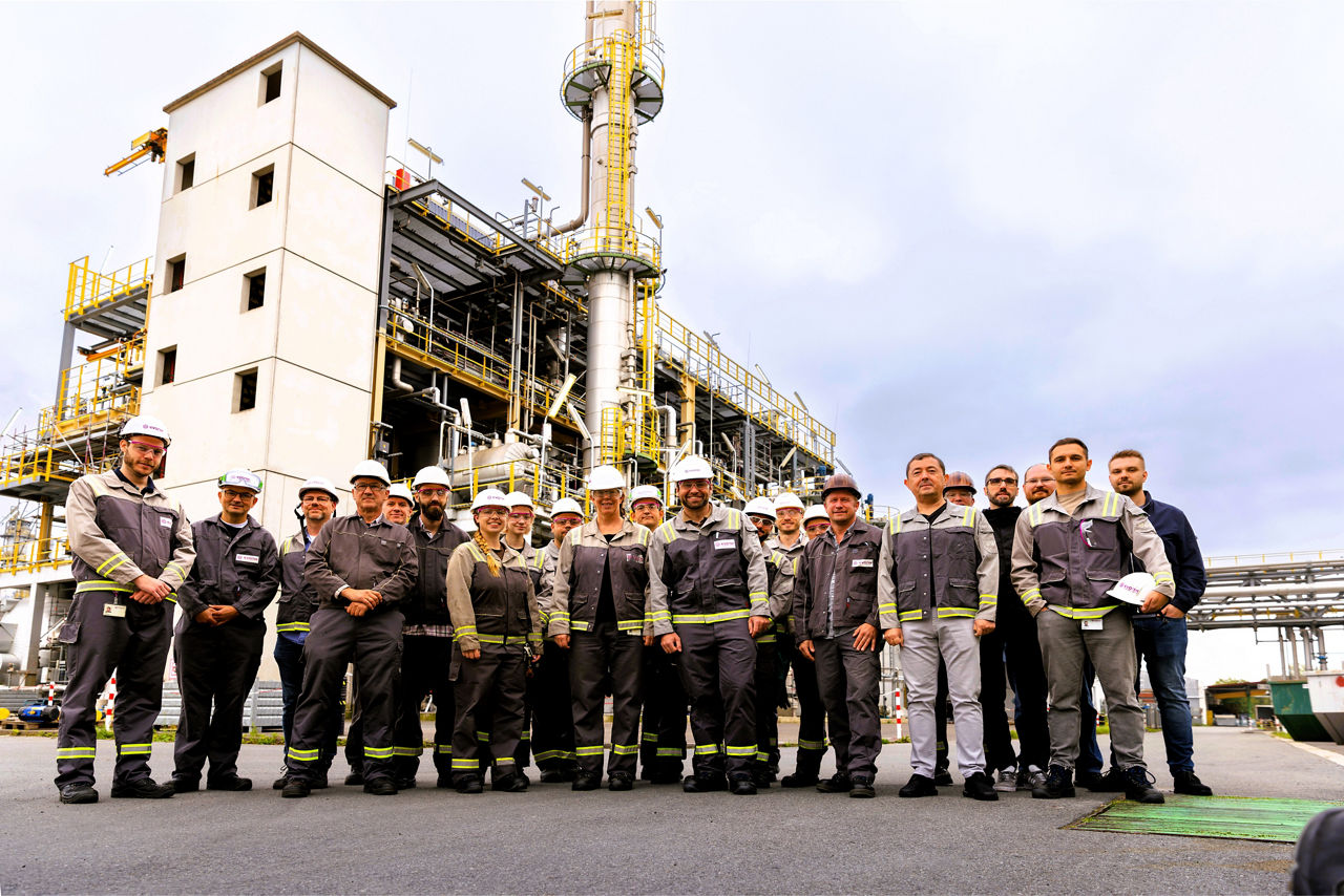 A group of Evonik employees in front of the Polyvest plant at the Evonik site in Marl, North Rhine-Westphalia, Germany.
