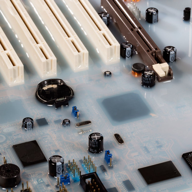 Mainboard card computer flooded by white colored water