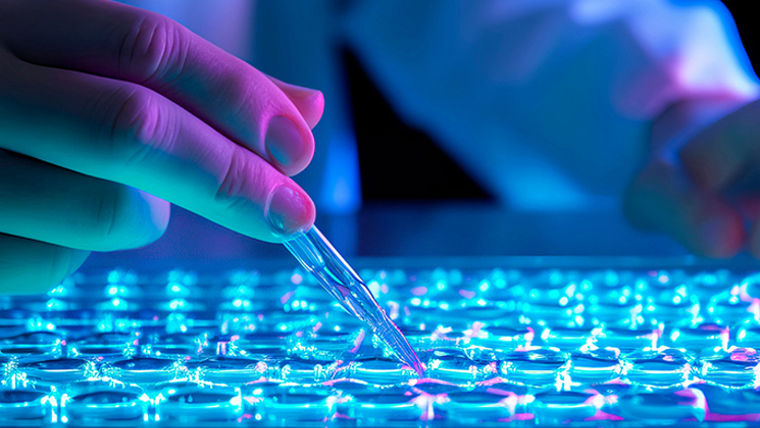 researcher's hands holding a pipette tip just above a microplate well, ready to dispense a small sample for analysis.