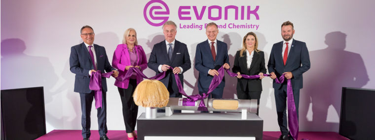 Evonik representatives at a ribbon-cutting ceremony for the expansion of gas separation membrane production.