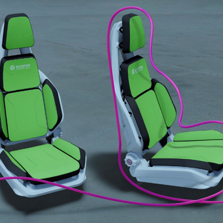 Three automotive seat models with layered green components and lightweight structure, illustrating a monomaterial design for improved recyclability and circular production