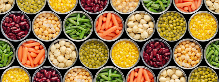 Seamless food background made of opened canned chickpeas, green sprouts, carrots, corn, peas, beans and mushrooms on black background