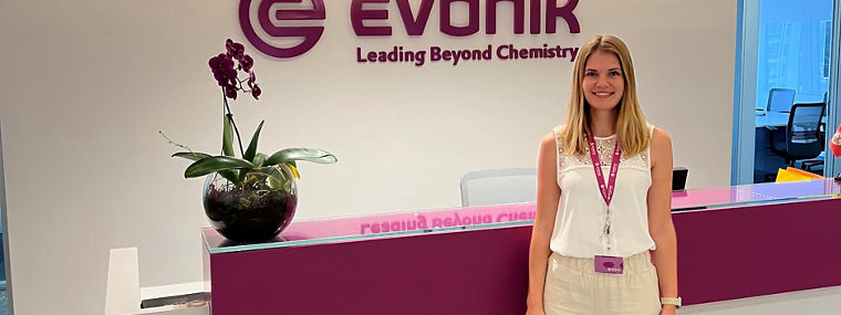 Reception area at Evonik with a logo and a welcoming atmosphere.