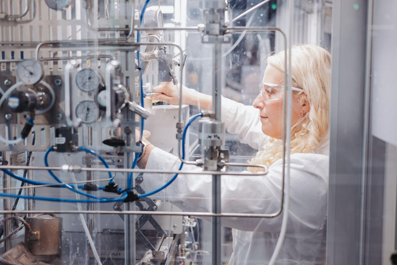 Chemical engineer Lisa Steinwachs adjusts settings in the plant.