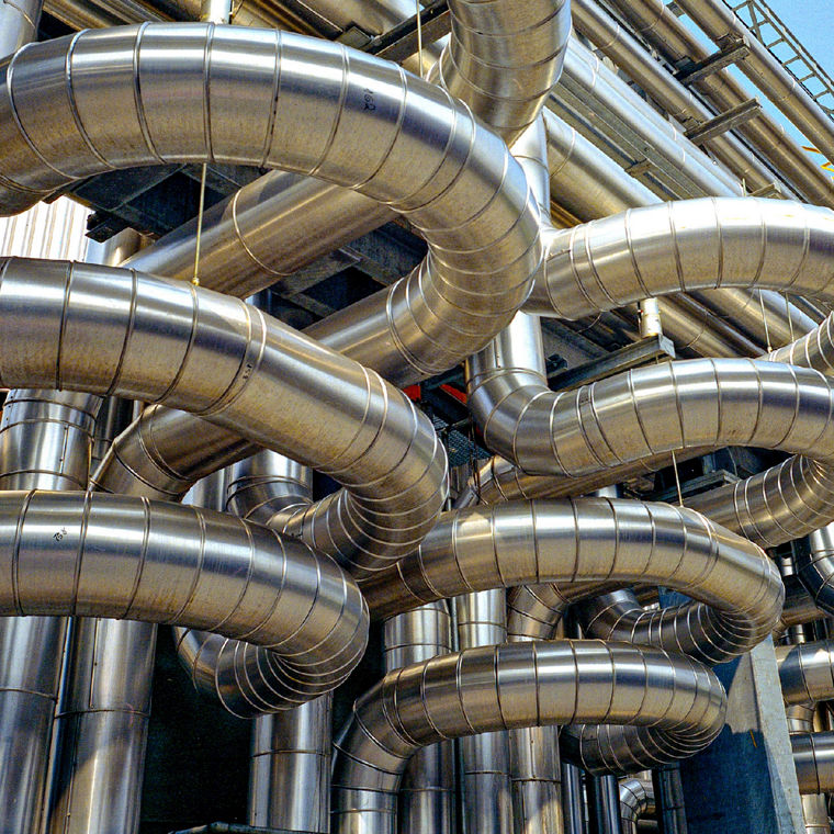 Many curved pipes in a chemical plant.