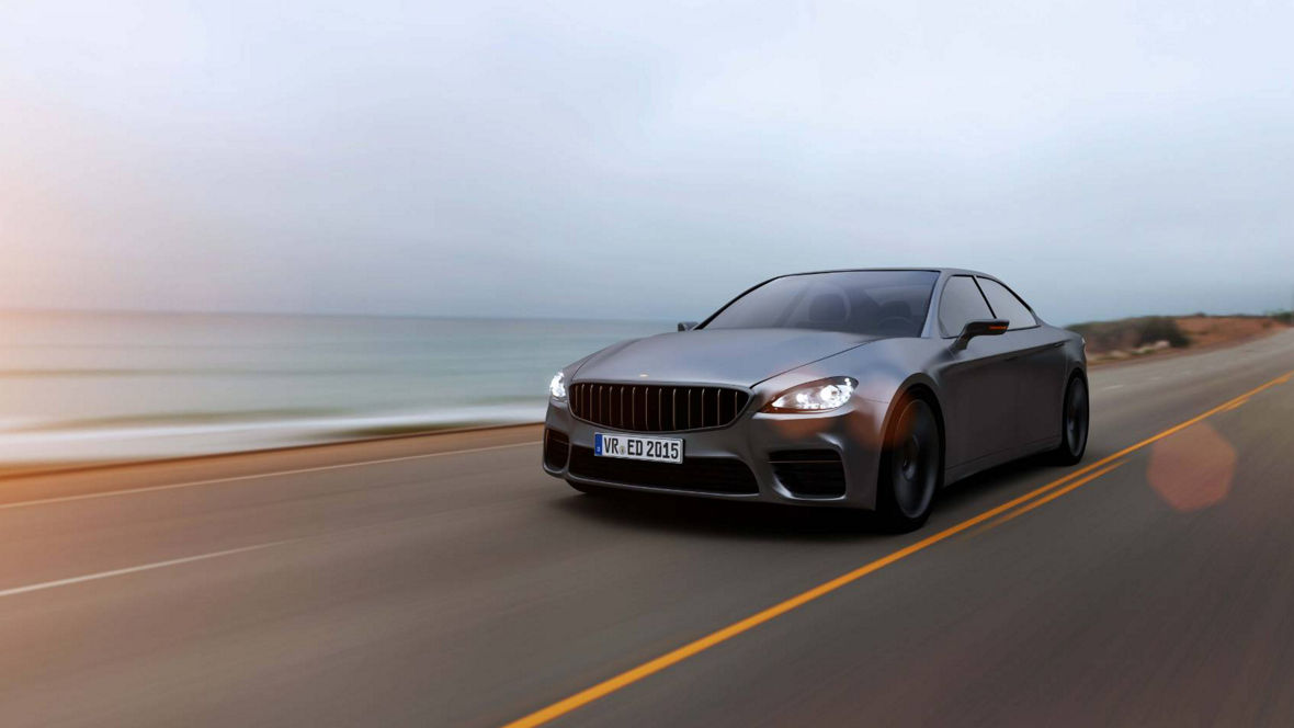 Sleek gray sports car driving on a coastal road with ocean waves and sunset in the background.