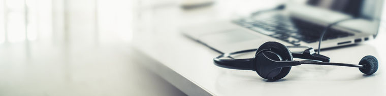 Headset and customer support equipment at call center ready for actively service . Corporate business help desk and telephone assistance concept .