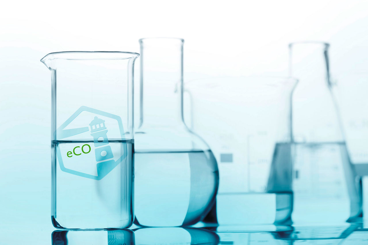 Group of glass flasks with a clear liquid, isolated
