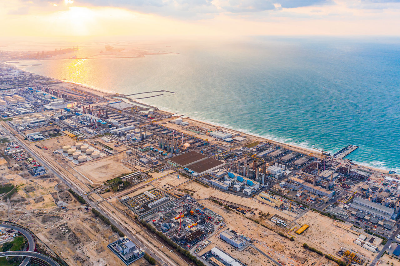 Aerial view of a petrochemical oil refinery and the sea in Dubai