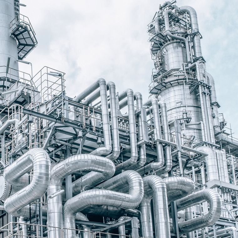 An oil refinery with many pipes.