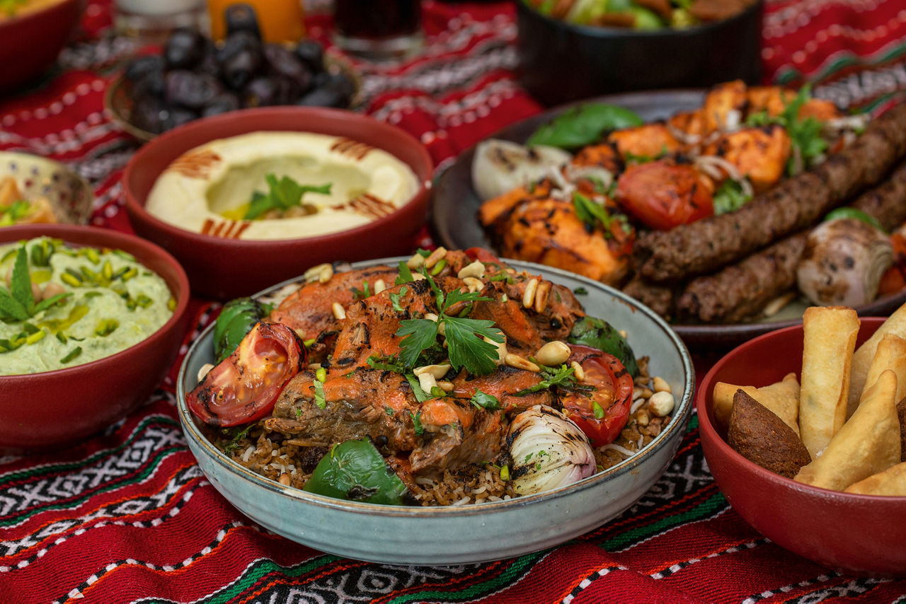 Lamb Ouzi in a bowl on a table in an Arabic restaurant.