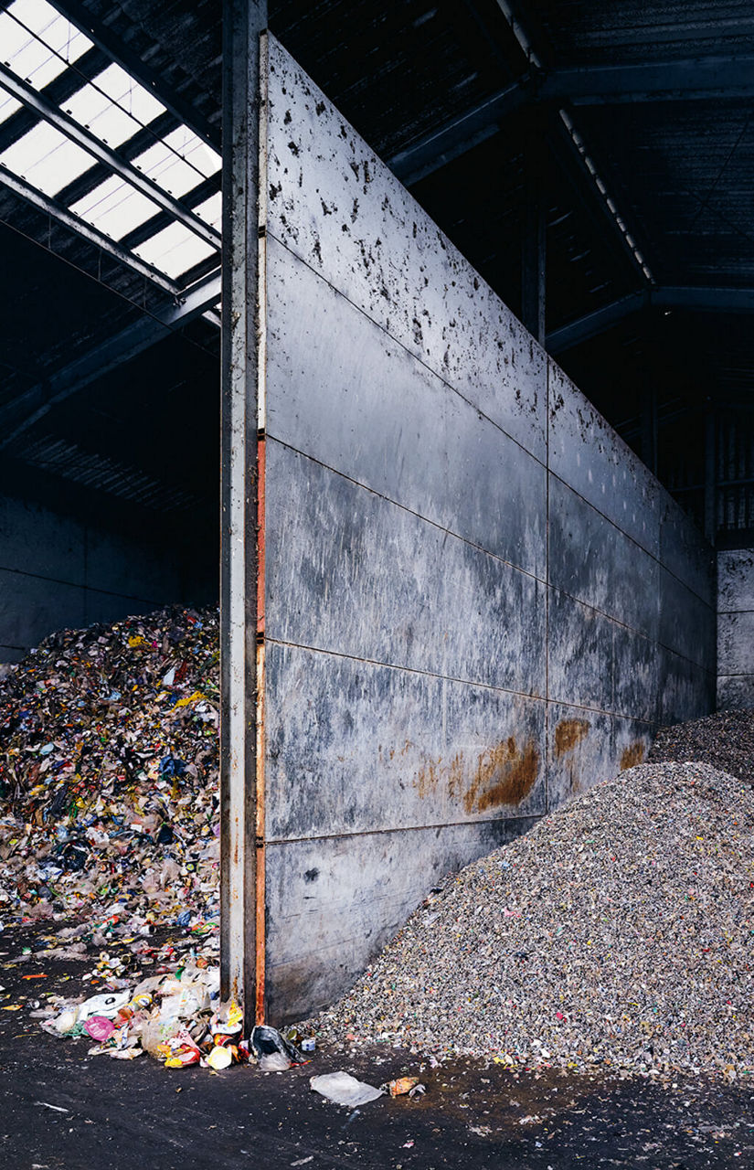 Two storage chambers with plastic parts shredded to different sizes.