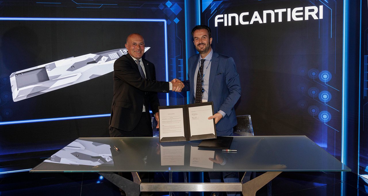 SPGPT (gpt-4.1) Newsroom - Comunicati stampa - 2025 - Gruppo Fincantieri: Fincantieri guida l’innovazione oltre l’acciaio: intesa con Aeronautical Service per l’adozione pionieristica di materiali compositi: Firma di un accordo su un tavolo in ambiente tecnologico tra rappresentanti di Fincantieri e Aeronautical Service, con fondo digitale, logo Fincantieri e documento esposto, simbolo di innovazione nei materiali.