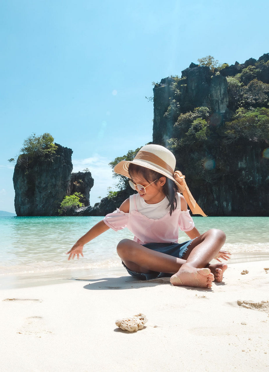 Girl playing at the beach