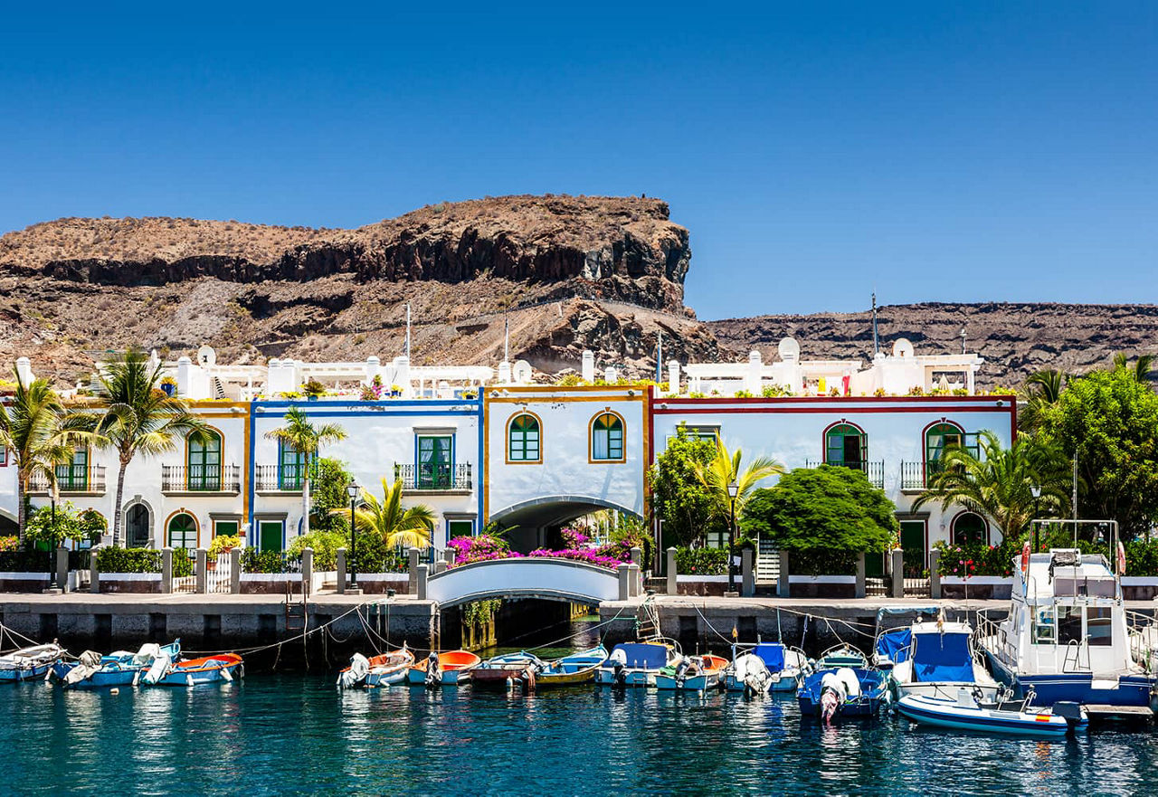 Colorful waterfront houses at the harbor of Puerto de Mogan