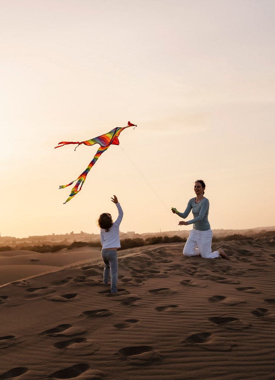 Mother and son let kite fly