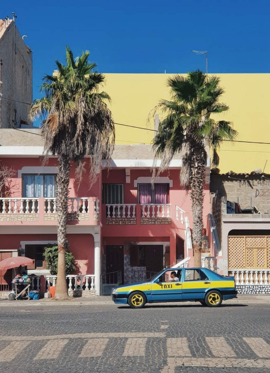 Taxi Outside Colourful Buildings