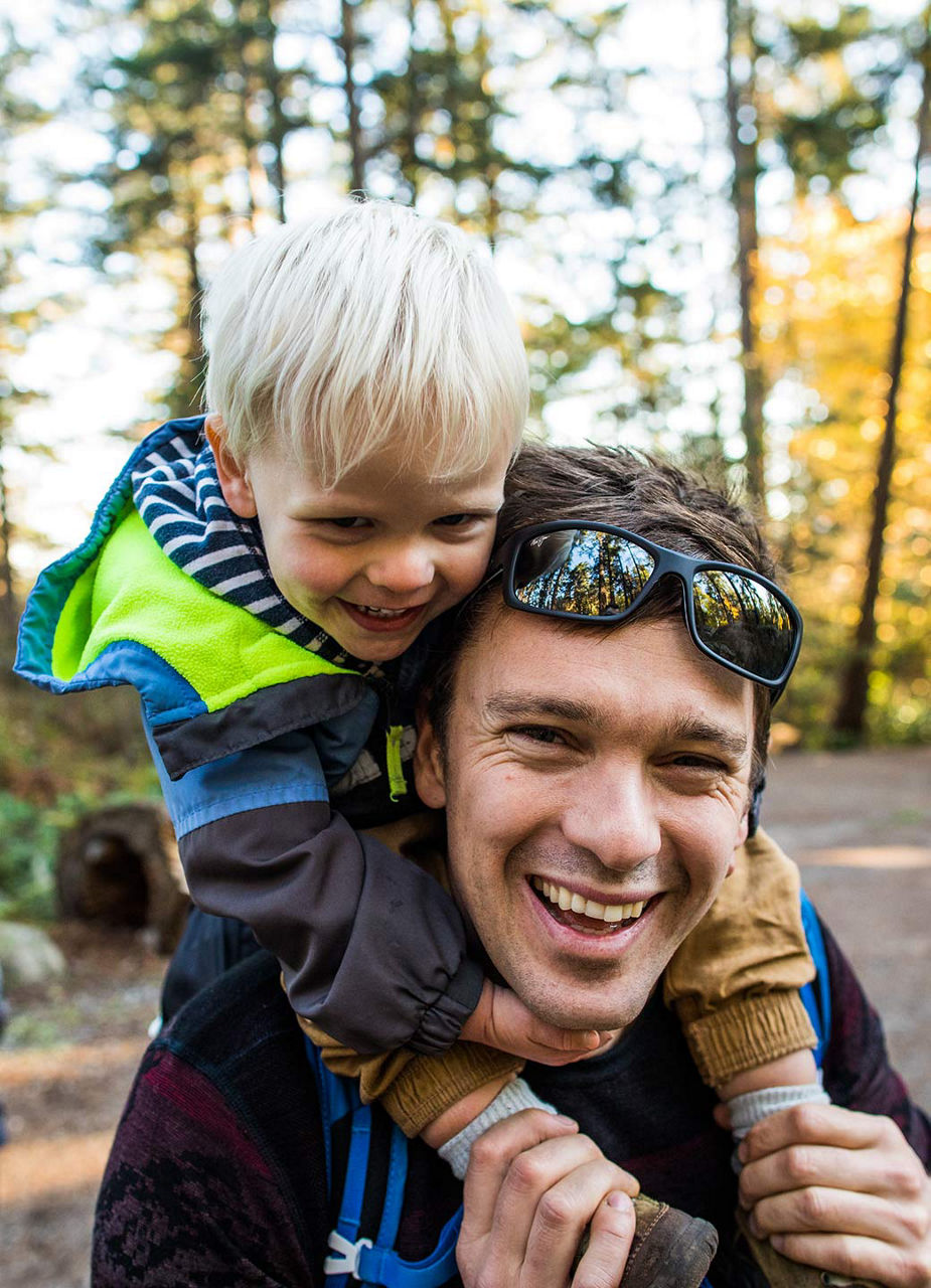 Father and son hiking through the forest