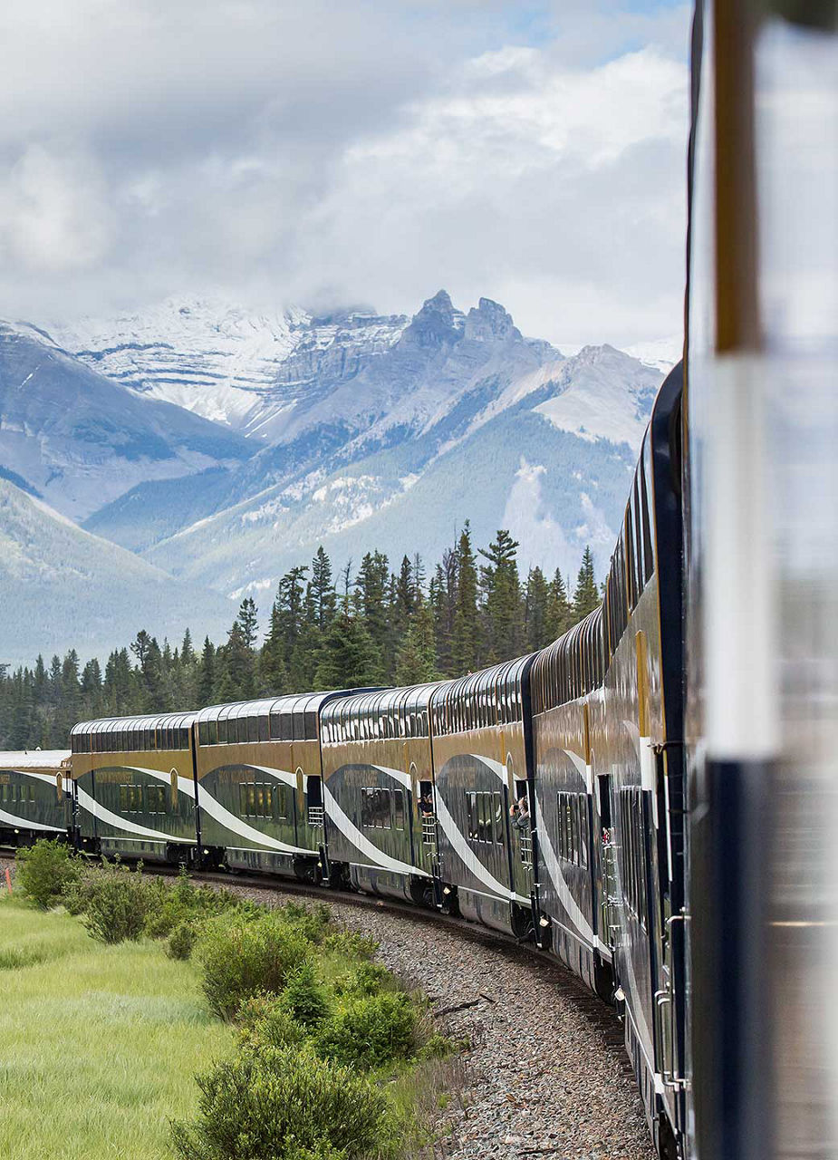 Train driving through Rockies