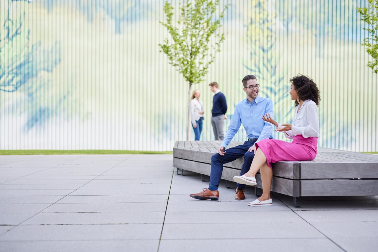 colleagues interacting on the campus