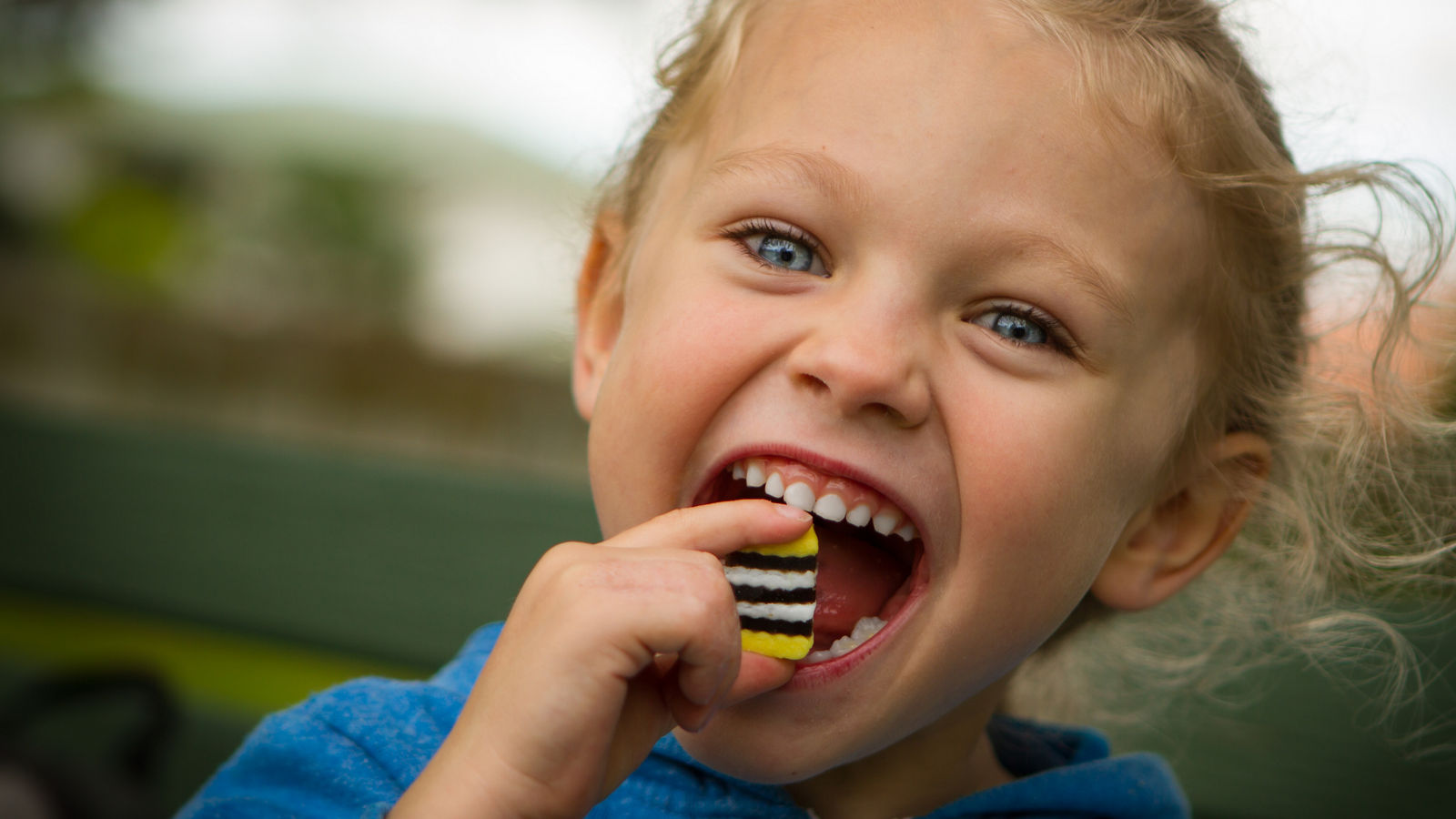 young child eating sweets