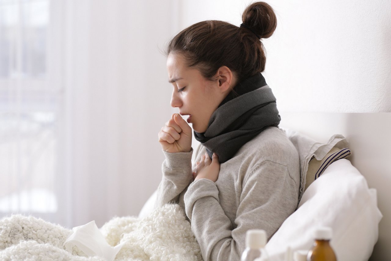 Young ill woman in bed at home