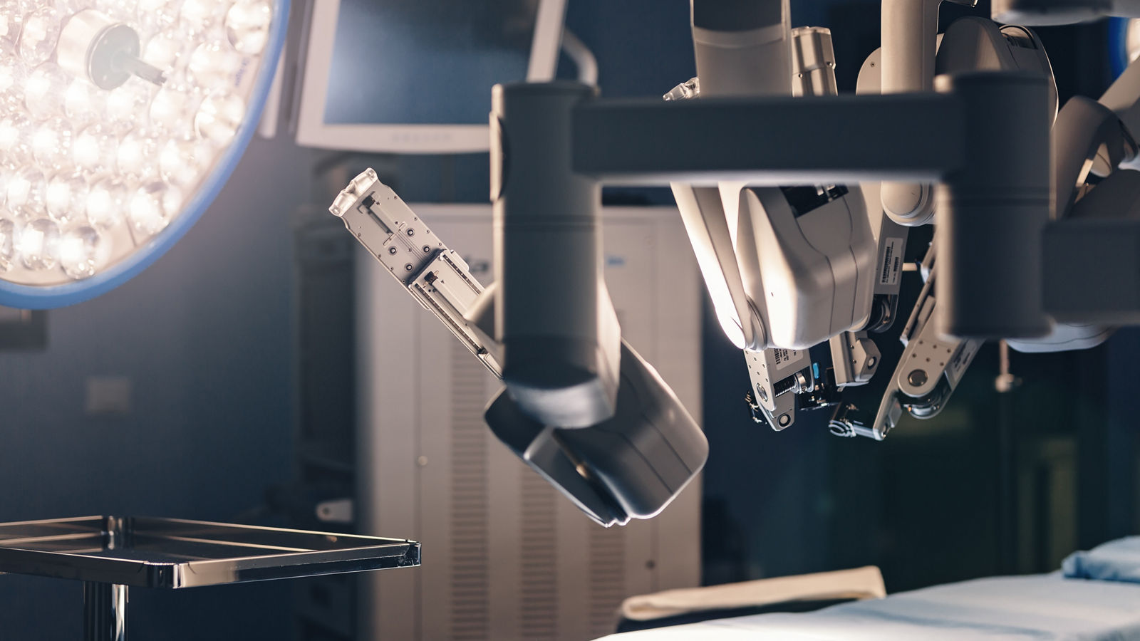 Surgical room in hospital with robotic technology equipment, machine arm surgeon in futuristic operation room. Minimal invasive surgical inoovation, medical robot surgery with 3D view endoscopy