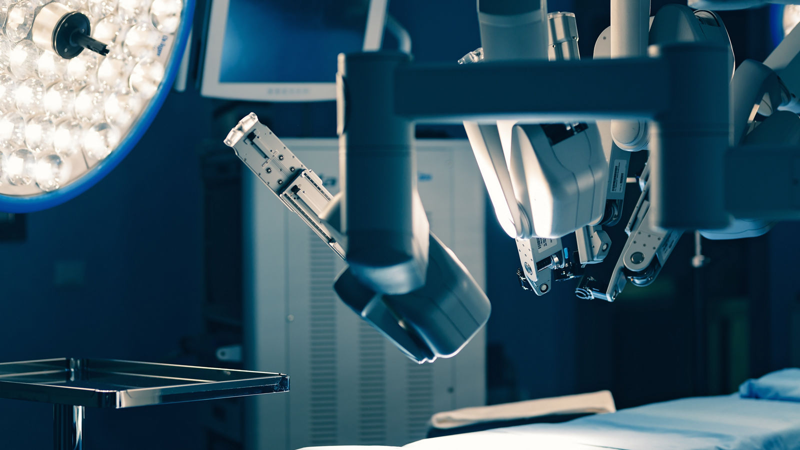 Surgical room in hospital with robotic technology equipment, machine arm surgeon in futuristic operation room. Minimal invasive surgical inoovation, medical robot surgery with 3D view endoscopy
