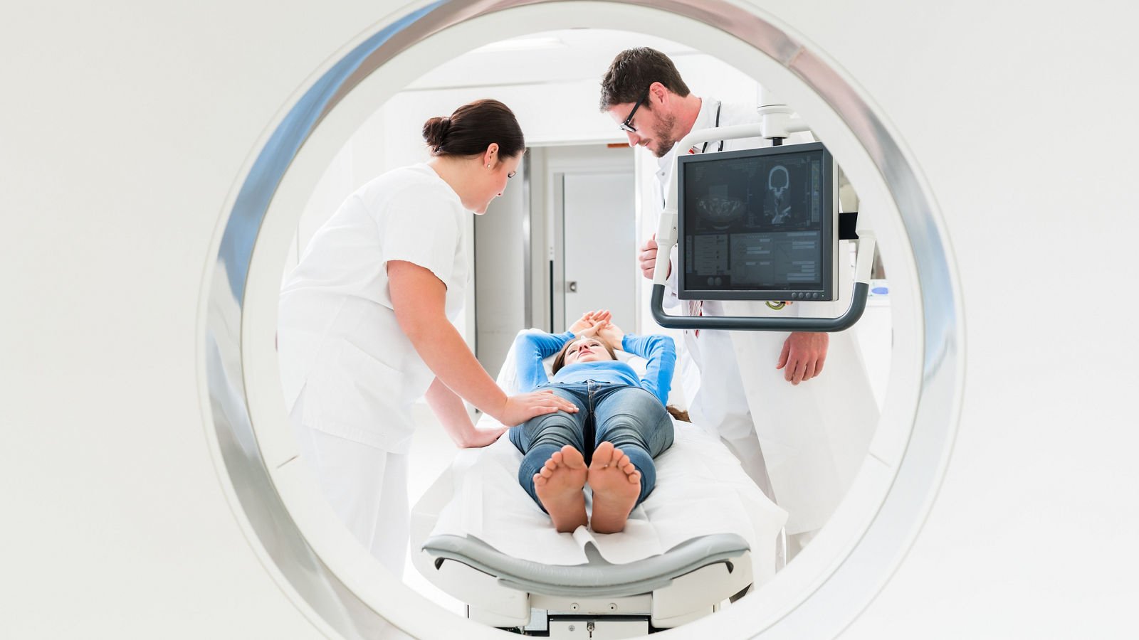 Doctor, nurse, and patient at CT scan