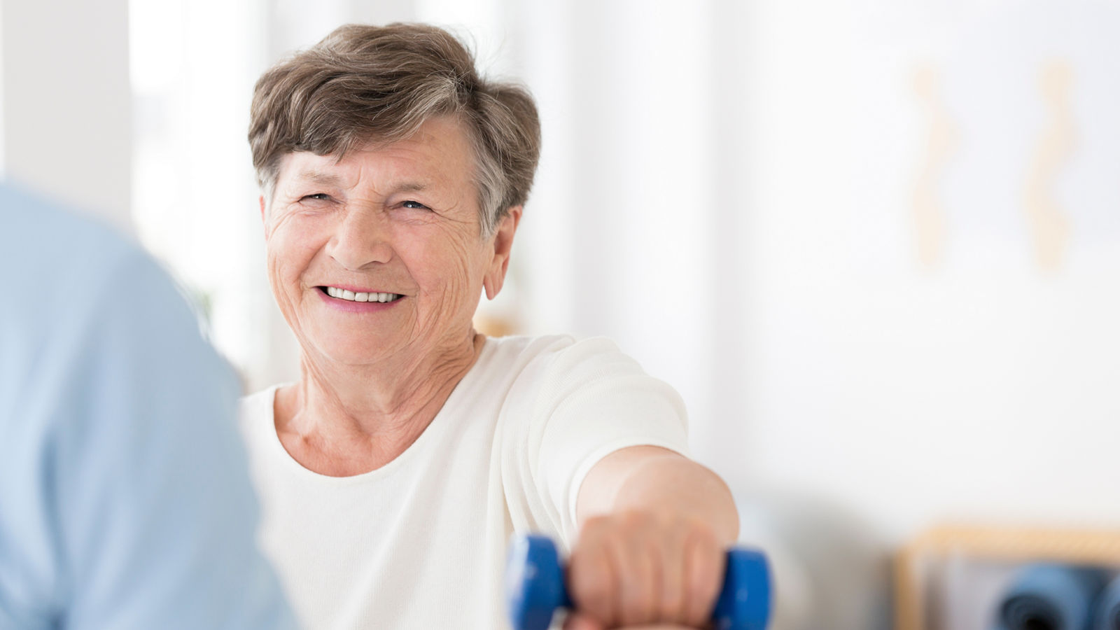 Senior woman exercising with weights