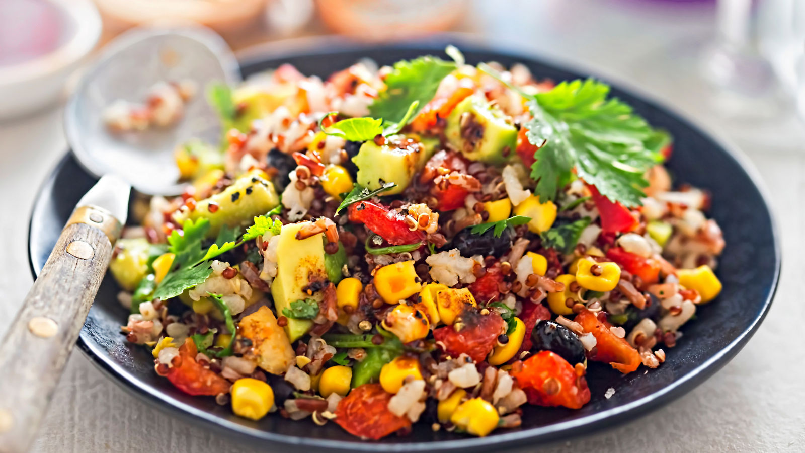 Black beans, avocado, corn, tomato, rice & quinoa salad with chilli dressing 