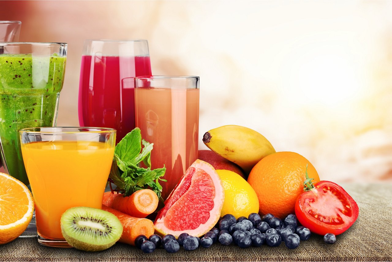 Composition of fruits and glasses of juice