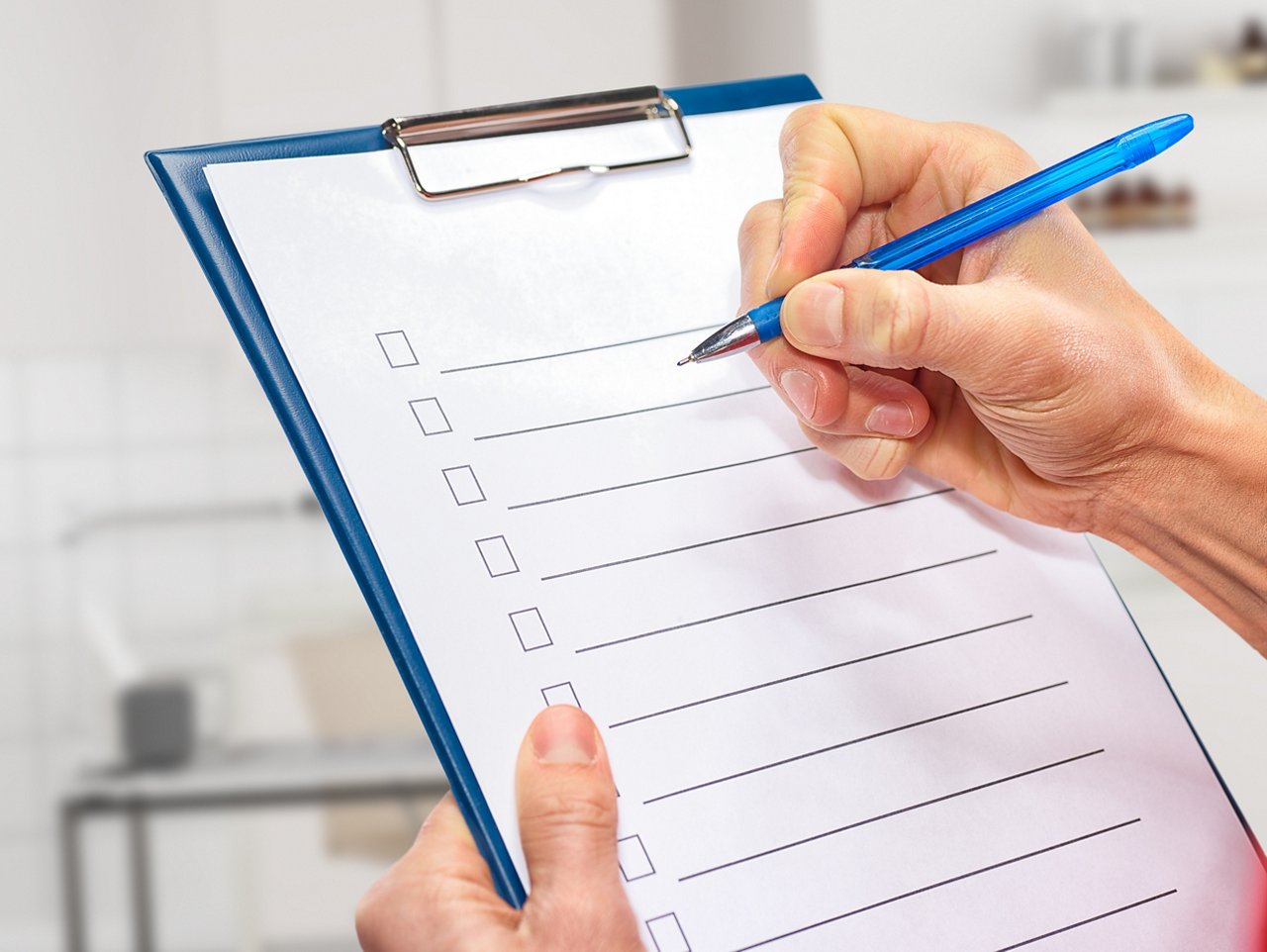 A man works with a checklist. Courier.