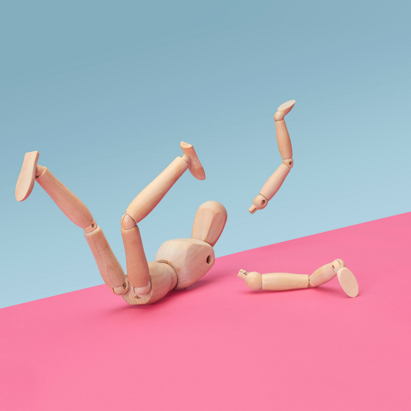 Wooden modelling doll fallen over and broken