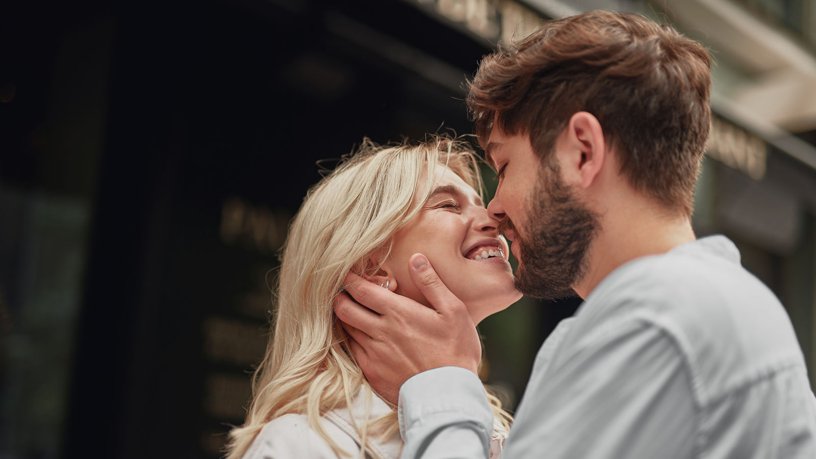 Smiling man is looking at the happy woman