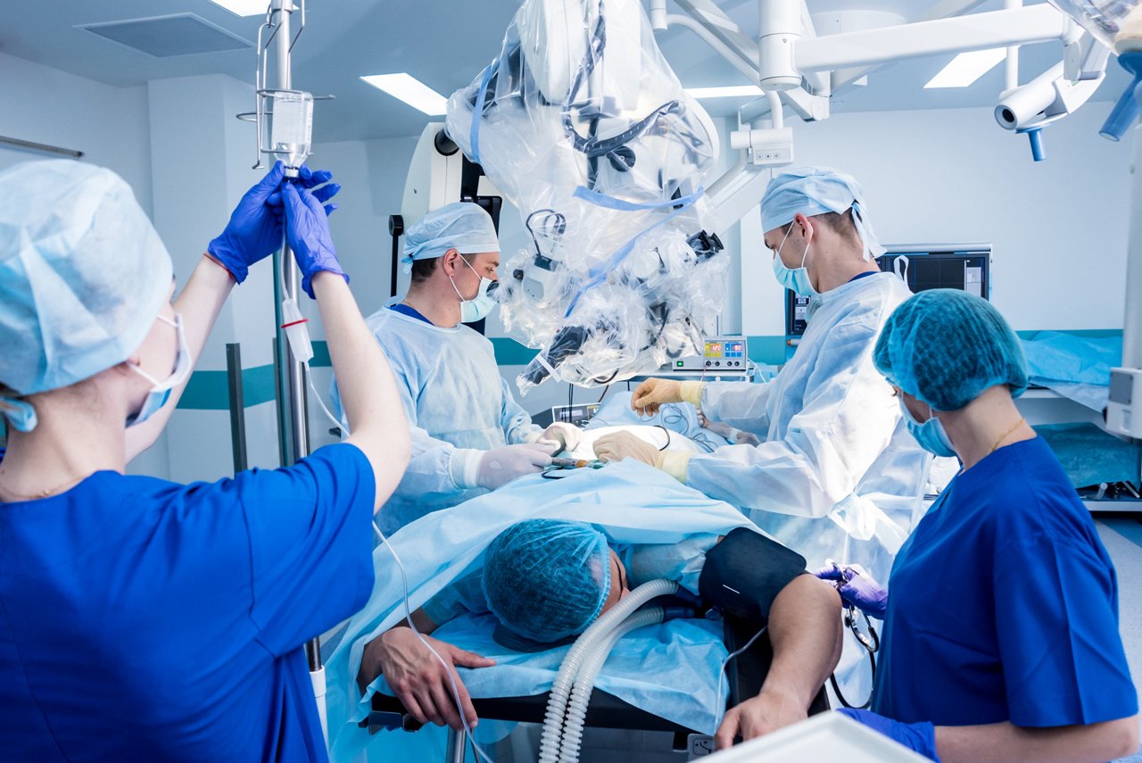 Spinal surgery. Group of surgeons in operating room with surgery equipment. Laminectomy. Modern medical background