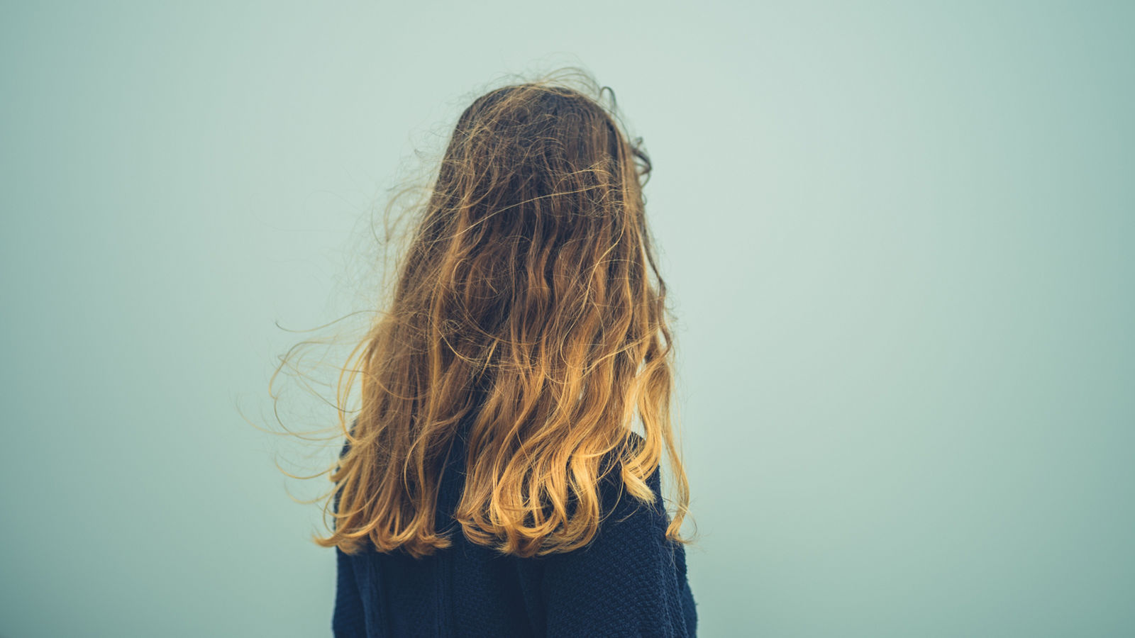 Young woman standing in the mist
