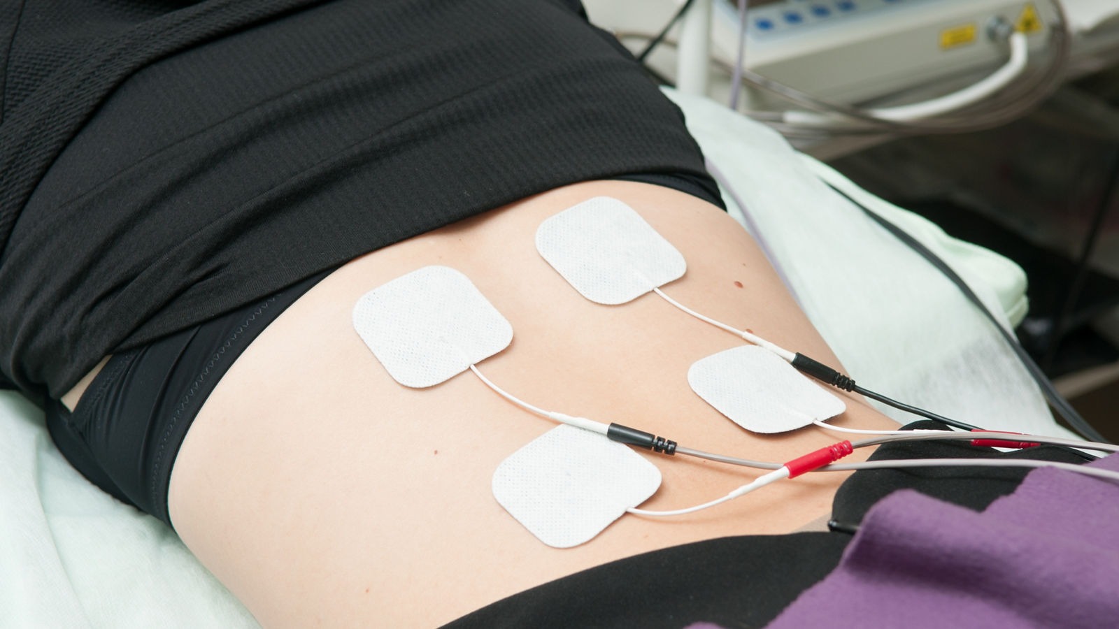 Ultrasound and electrotherapy treatment for a young woman