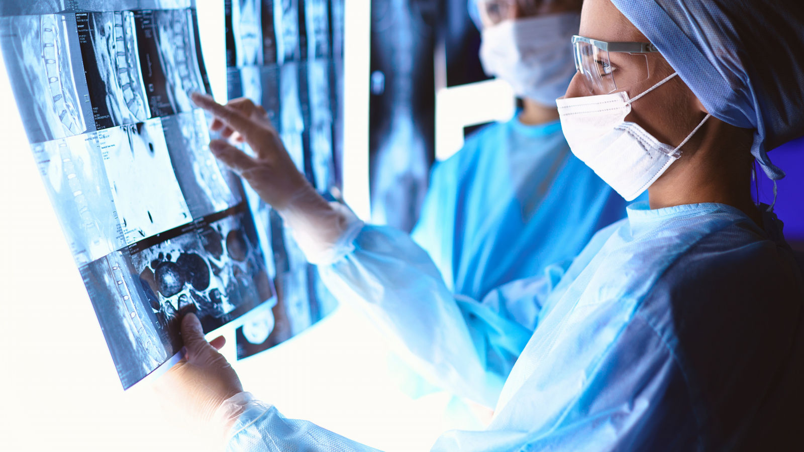Doctors analyzing an x-ray in a meting