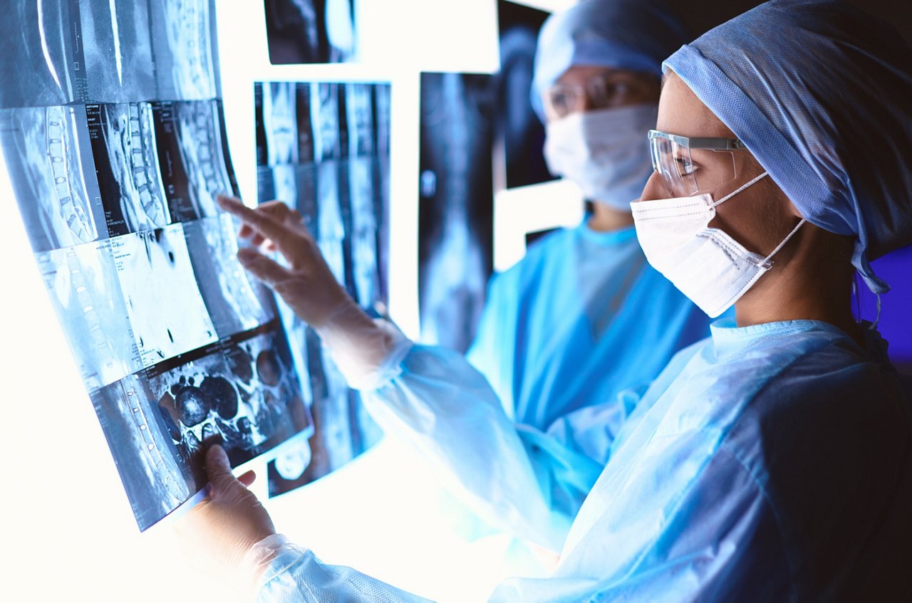 Doctors analyzing an x-ray in a meting.