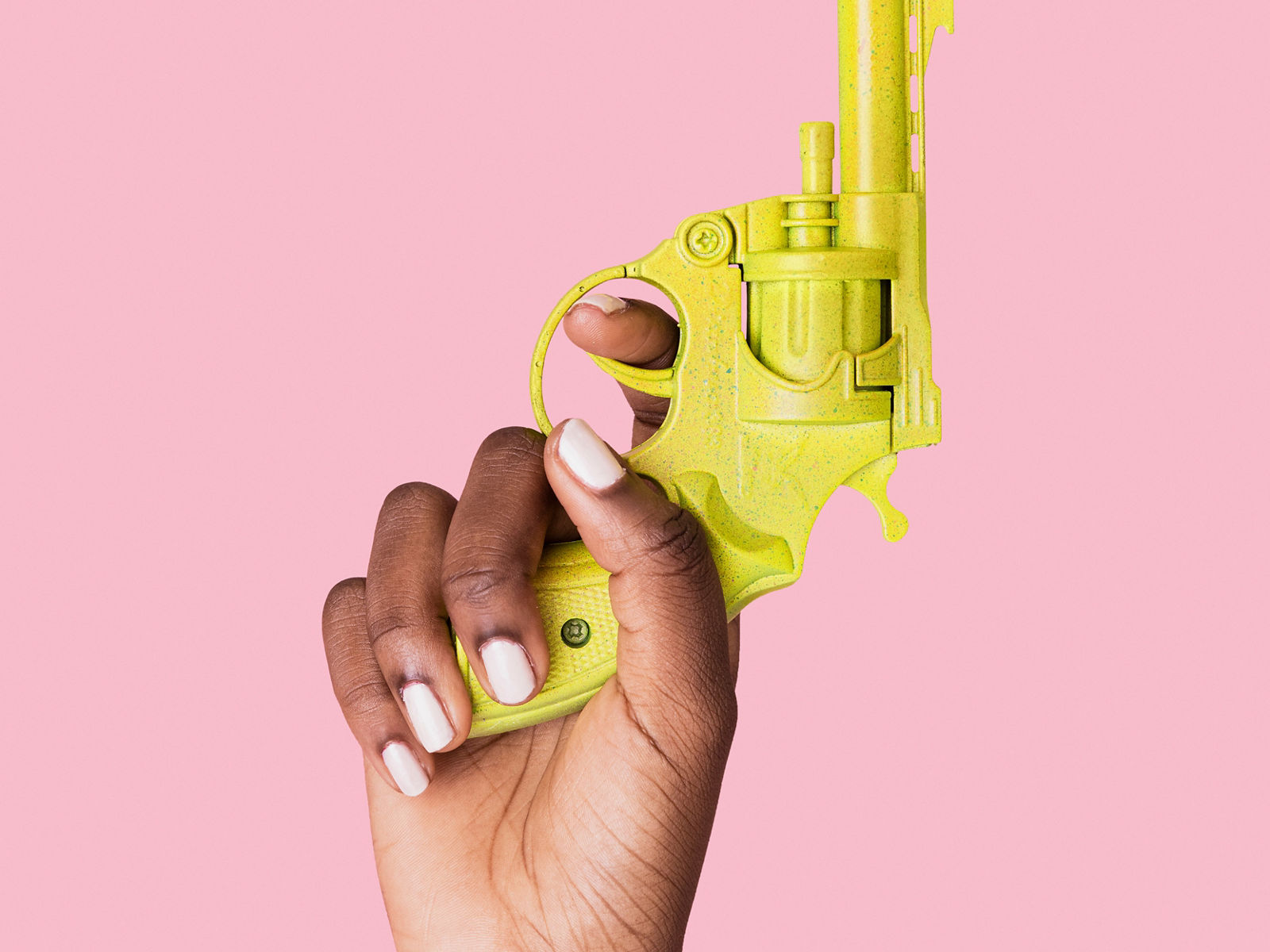 Hand holding gun raising up isolated on background