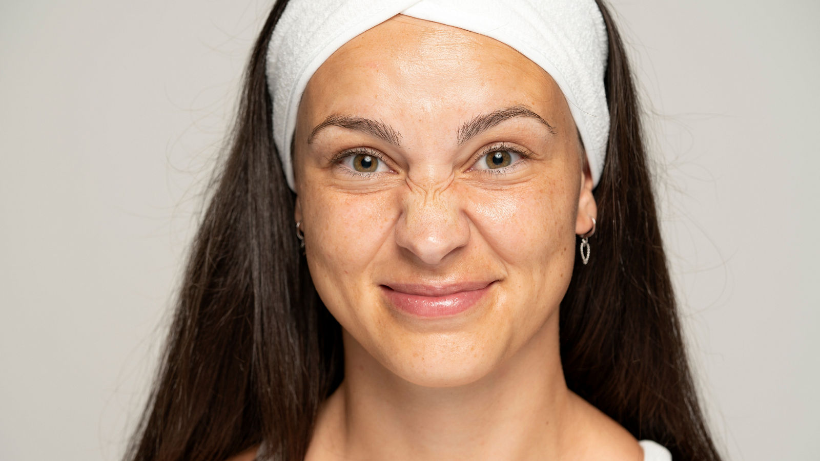 young woman frown the wrinkles around her nose